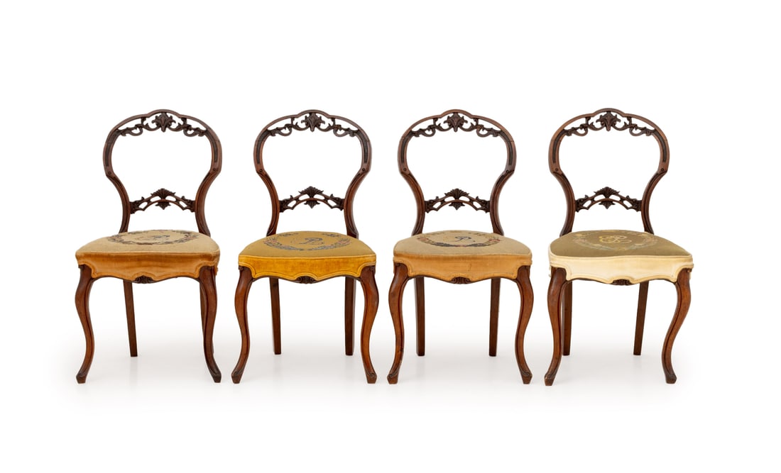 Elizabeth II Needlepoint Upholstered Chairs, 4: Set of Four Elizabeth II Needlepoint Upholstered Mahogany Chairs, circa 1953, the pierced backs carved with floral motifs. 34.75" H x 18" W x 17" D; seat: 17.5" H. Provenance: From a Greenwich, Connec