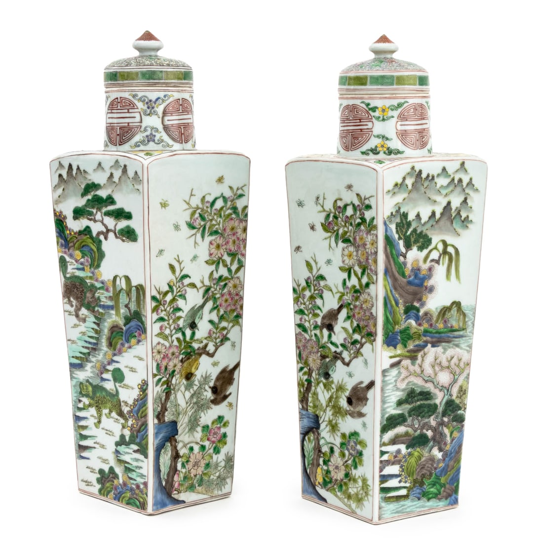 Chinese Famille Verte Porcelain Covered Vases, 2: Pair of Chinese Famille Verte Porcelain Square Covered Vases, each with circular lid above quadratic tapered body with foo lion, bird, and landscape scene motifs, blue six character Kangxi mark to