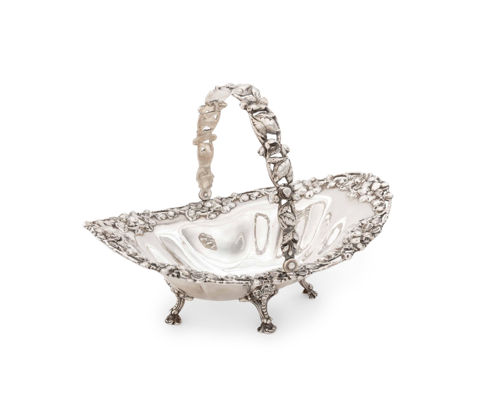 Theodore B. Starr Sterling Silver Basket, ca. 1900: Theodore B. Starr Sterling Silver Basket, circa 1900, with floral repousse motif, swing handle, and four floral feet, marked to underside. Weight: 10.30 ozt.; 6.5" H x 8.75" W x 6" D. Provenance: The