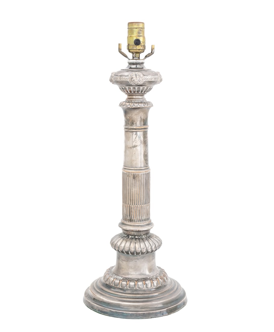 Empire Style Silver Plate Column Form Lamp: Empire Style Silver Plate Column FOrm Table Lamp, the fluted column topped with lion masques, with single light socket. 21" H x 8" Diameter. Provenance: The Estate of Gilbert C. Maurer, Director and F
