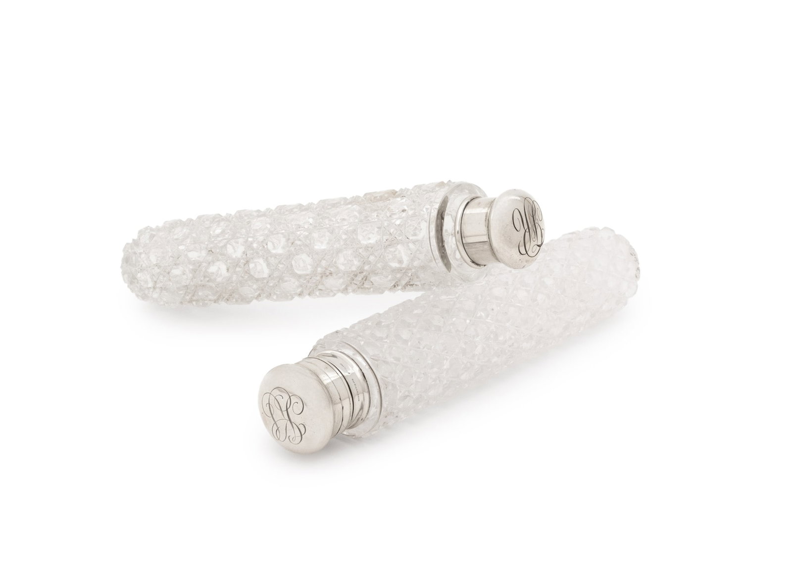 Tiffany & Co. Sterling & Crystal Scent Bottles, 2: Near Pair of Tiffany and Company Sterling Silver and Cut Crystal Scent Bottles, with monograms to the lids, marked "Tiffany & Co. / Sterling" to the lids. Silver not weighable. 7" L x 1.5" Diameter. P