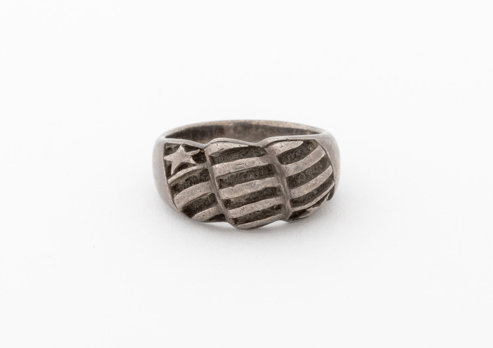 Sterling Silver Star and Stripes Motif Dome Ring: Sterling Silver Star and Stripes Motif Dome Ring, designed as a woven bombe ring, marked: "CL .925". Measuring approx. US size 10 1/2, 0.33 ozt. Provenance: From a New York City Collection. Keywords: 