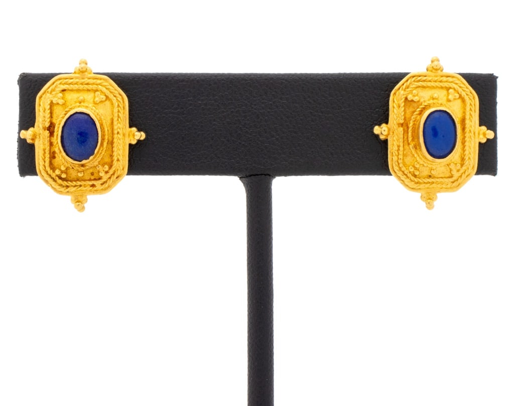 Etruscan Revival 22K Gold and Lapis Earrings: Pair of Etruscan Revival Style 22K Yellow Gold and Lapis Lazuli Bezel Set Granulation Earrings, worn on the ear with omega clip and pad. Measuring approx. 7/8" x 3/4"; depth: 5.3mm; weight: 5.9 dwt. P