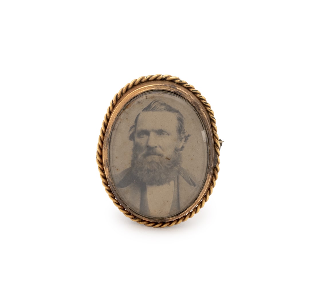 Victorian Gold Filled Photo Brooch: Victorian Gold Filled Photo Brooch, featuring one oval glass covered tintype approx. 34 x 24 mm., worn through fabric with pinstem, joint and catch, may be worn pendant with fixed open jumpring. Gold 