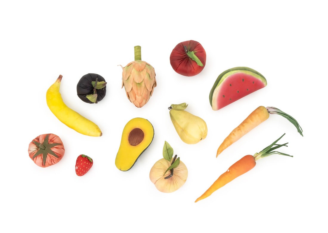 Vintage Fabric Fruits and Vegetables, 12: Collection of Twelve Vintage Fabric Fruits and Vegetables, including; avocado, watermelon, carrots, artichoke, pear, and apple. Largest: 6.5" L x 3.5" Diameter. Provenance: From a 45 Sutton Place Sout