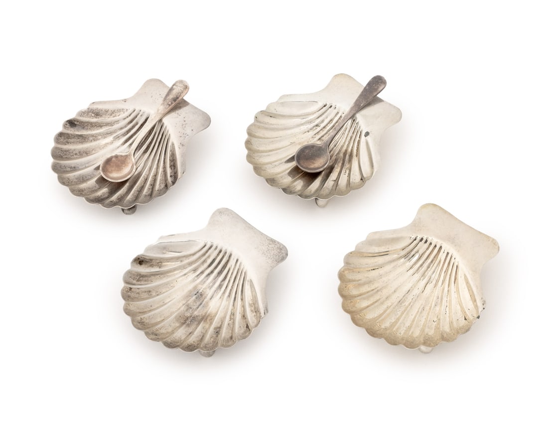 Mexican Sterling Silver Tableware, 6 Pcs.: Set of Six Mexican Sterling Silver Tableware Pieces, comprising: four Maciel shell form open salt cellars on three ball form feet, marked to undersides, and two salt spoons, marked "925" to the handle
