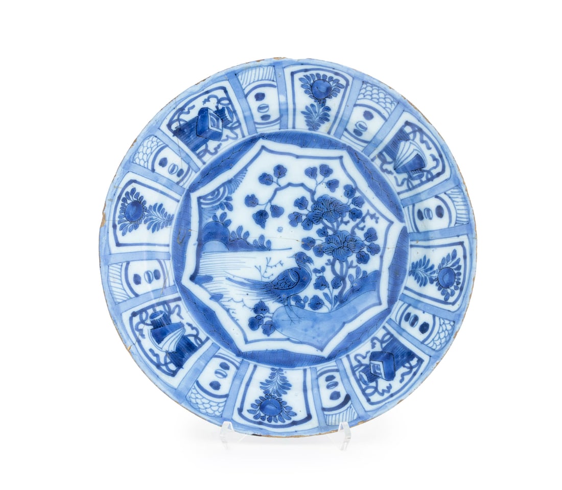 Chinese Export Blue & White Kraak Ware Charger: Chinese Export Blue and White Porcelain Kraak Ware Charger, probably 17th century, hand-painted with a watery landscape surrounded by floral and geometric vignettes. 13" Diameter x 2" H. Provenance: T