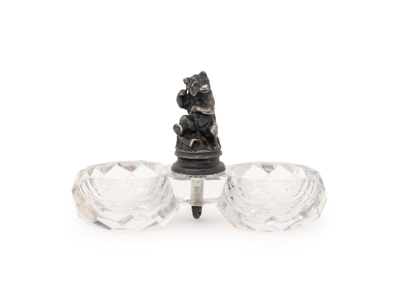 Christofle Bear Motif Cut Crystal Twin Open Salts: Christofle Silver Plate and Cut Crystal Double Open Salt Cellars, with bear figurine to center, struck with marks for Christofle to the base. 2.75 x 4.75" W x 2" D. Provenance: The Estate of Alton G. 