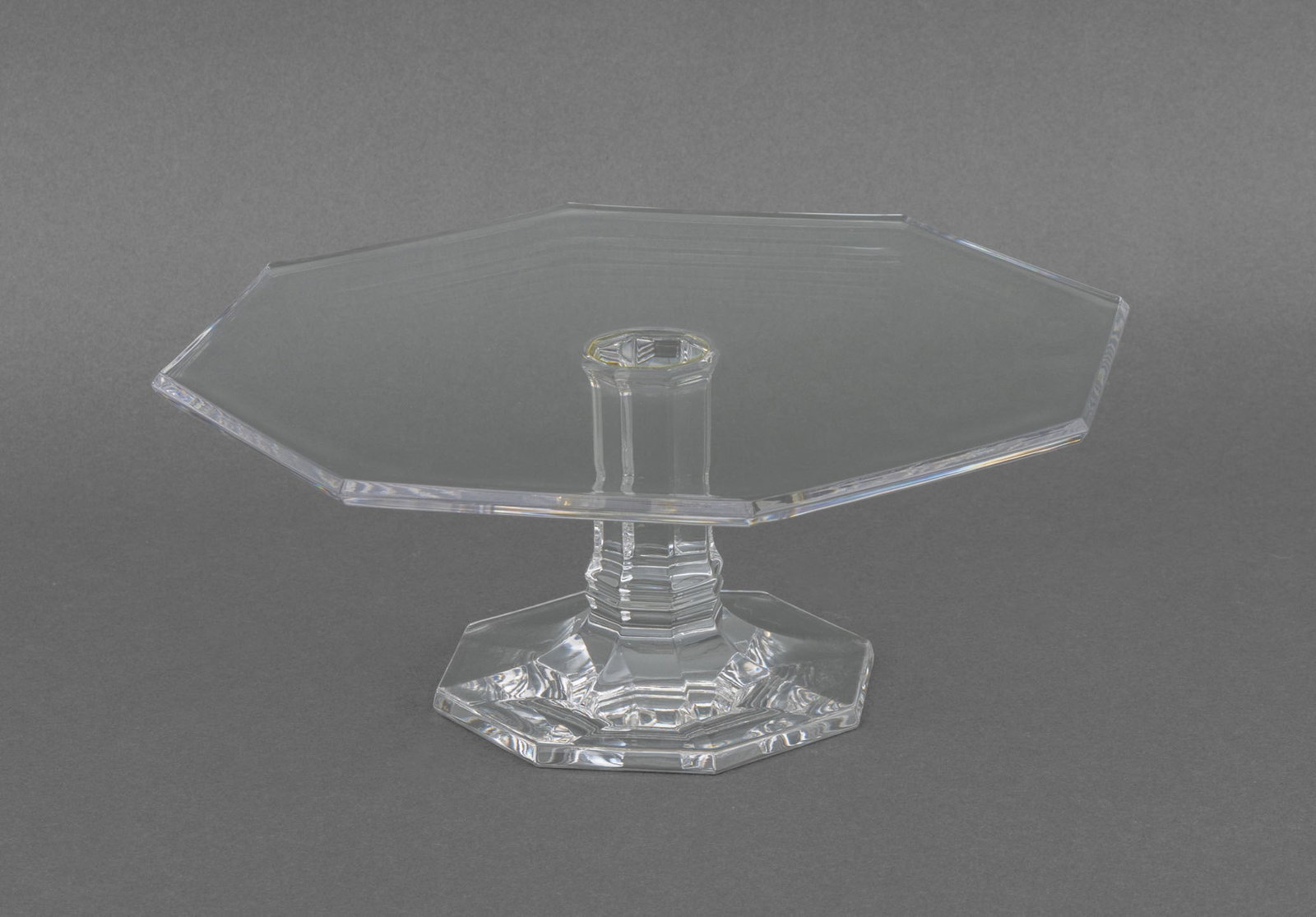 Tiffany & Co. Crystal Octagonal Cake Stand: Tiffany and Company Crystal Octagonal Cake Stand, etched mark to underside. 4.75" H x 11" W x 12" D. Provenance: From a New York City Estate. Keywords: Designer, T&Co., Luxury brand, Tableware,