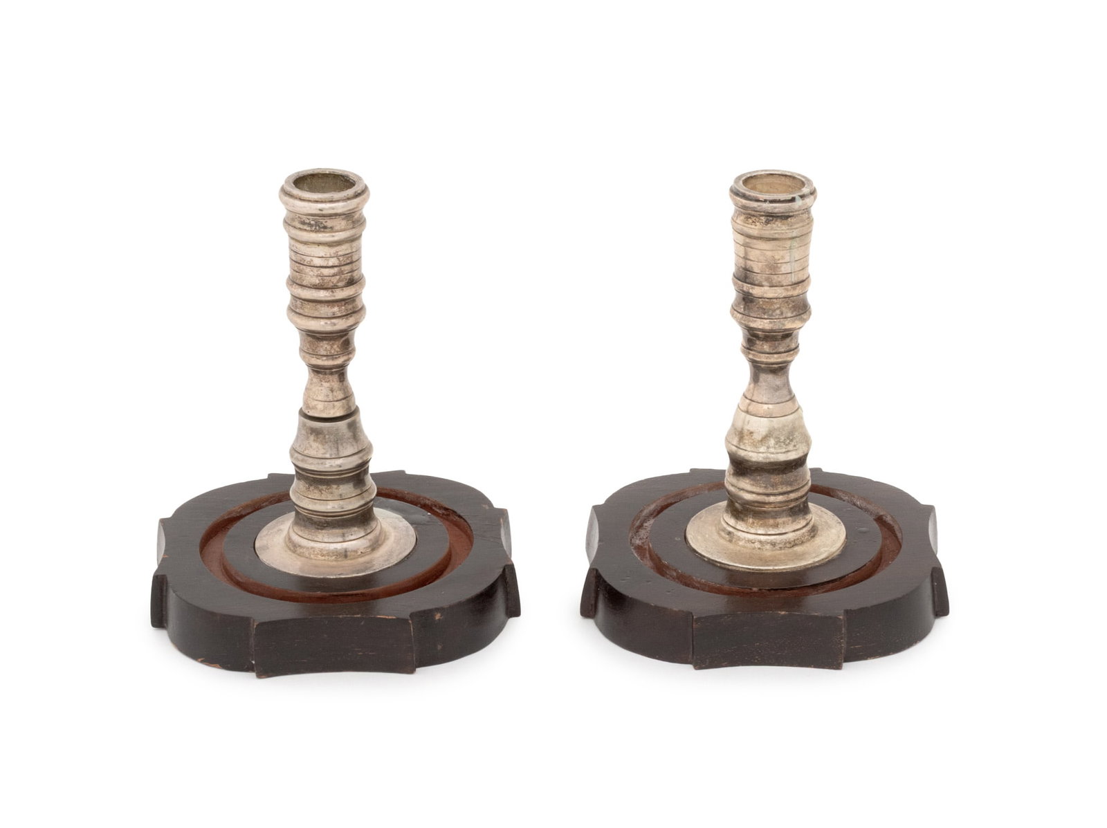 Turned Form Silver Plate Candlesticks, Pair: Pair of Turned Form Silver Plate Candlesticks, mounted on carved wood bases, "S P Collection" plaque to underside. 6.5" H x 5" W x 5" D. Provenance: From a Connecticut Estate. Keywords: Lighting, Silv