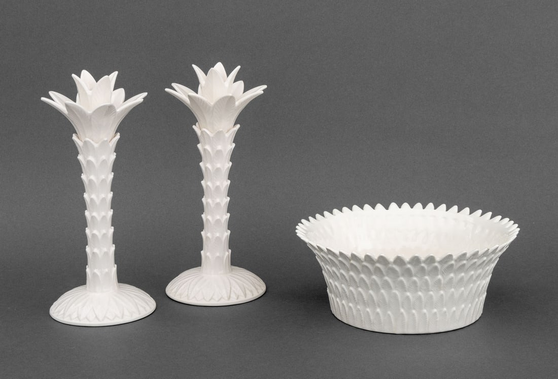 Fitz & Floyd Palm Leaf Motif Garniture Set, 3 Pcs.: Fitz and Floyd Palm Leaf Motif White Glazed Ceramic Three-Piece Garniture Set, a pair of candlesticks and a flaring bowl, all marked to undersides. Candlestick: 10" H x 4.25" W; bowl: 3.5" H x 8.75" D