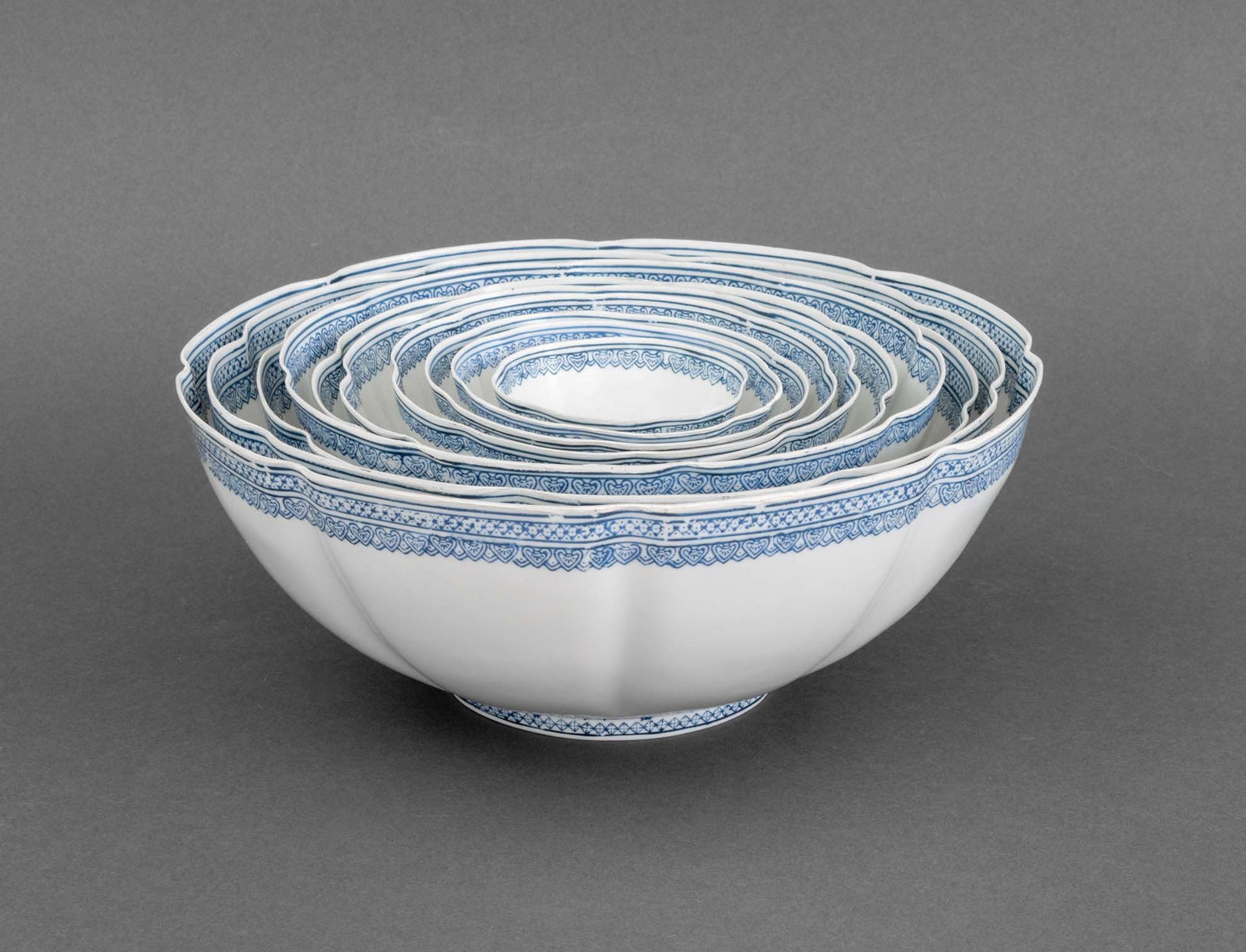 Chinese Blue & White Eggshell Porcelain Bowls, 10: Set of Ten Chinese Blue and White Eggshell Porcelain Bowls, nesting set with scalloped borders, six character marks to undersides. Largest: 4.25" H x 10.5" Diameter. Provenance: From a New York City C