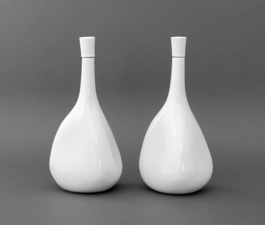 Kenji Fujita x Freeman Lederman Cruets, Pair: Pair of Kenji Fujita for Freeman Lederman Ceramic Cruet Bottles, marked underside. 9.5" H x 4.5" W x 3.5" D. Provenance: From a West End Avenue Collection. Keywords: Vessel, Modernist, Sculptural, Min