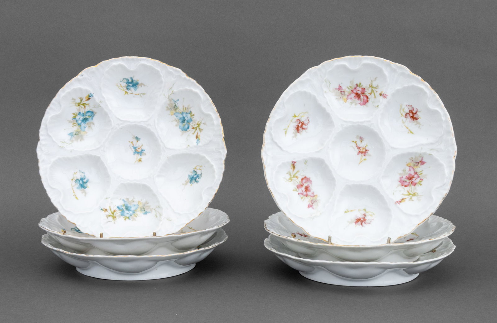 Victoria Carlsbad Porcelain Oyster Plates, 6: Set of Six Victoria Carlsbad Porcelain Oyster Plates, each with hand-painted flowers and gilt rim and marked "Victoria Carlsbad Austria" to underside. 8.75" Diameter x 1.5" H. Provenance: From a