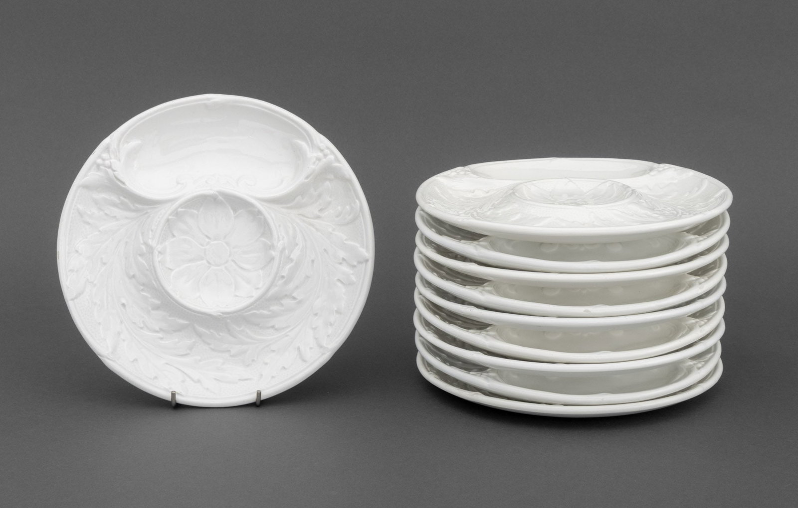 Gien France Ceramic Artichoke Plates, 10: Set of Ten Gien France Ceramic Artichoke Plates, with leaf form motif, marked "Gien France" to underside. 11" L x 10" Diameter. Provenance: From an East 74th Street Estate. Keywords: Designer,