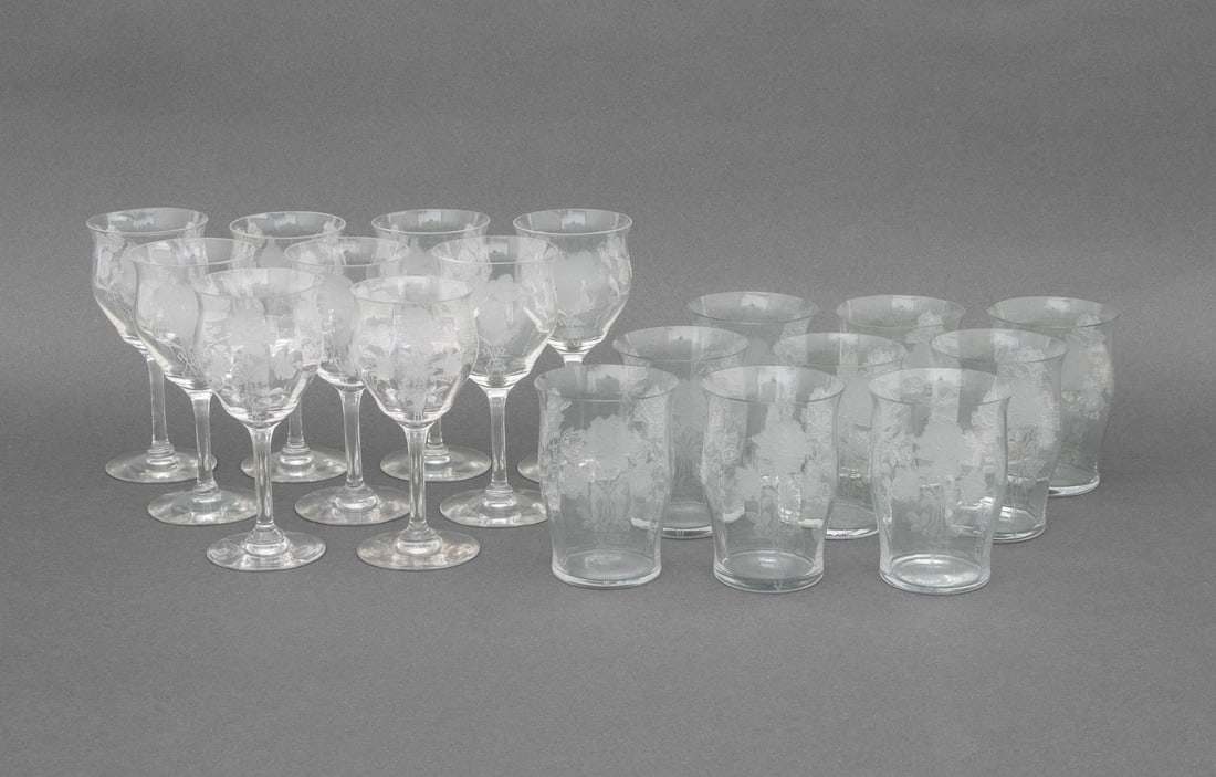 Rose Motif Etched Glass Drinkware, 18 Pcs.: Collection of 18 Rose Motif Etched Glass Drinkware Pieces, comprising: (9) nine wine glasses and (9) nine tumblers, unmarked. Taller: 5.75" H x 2.75" Diameter. Provenance: The Estate of Alton G.