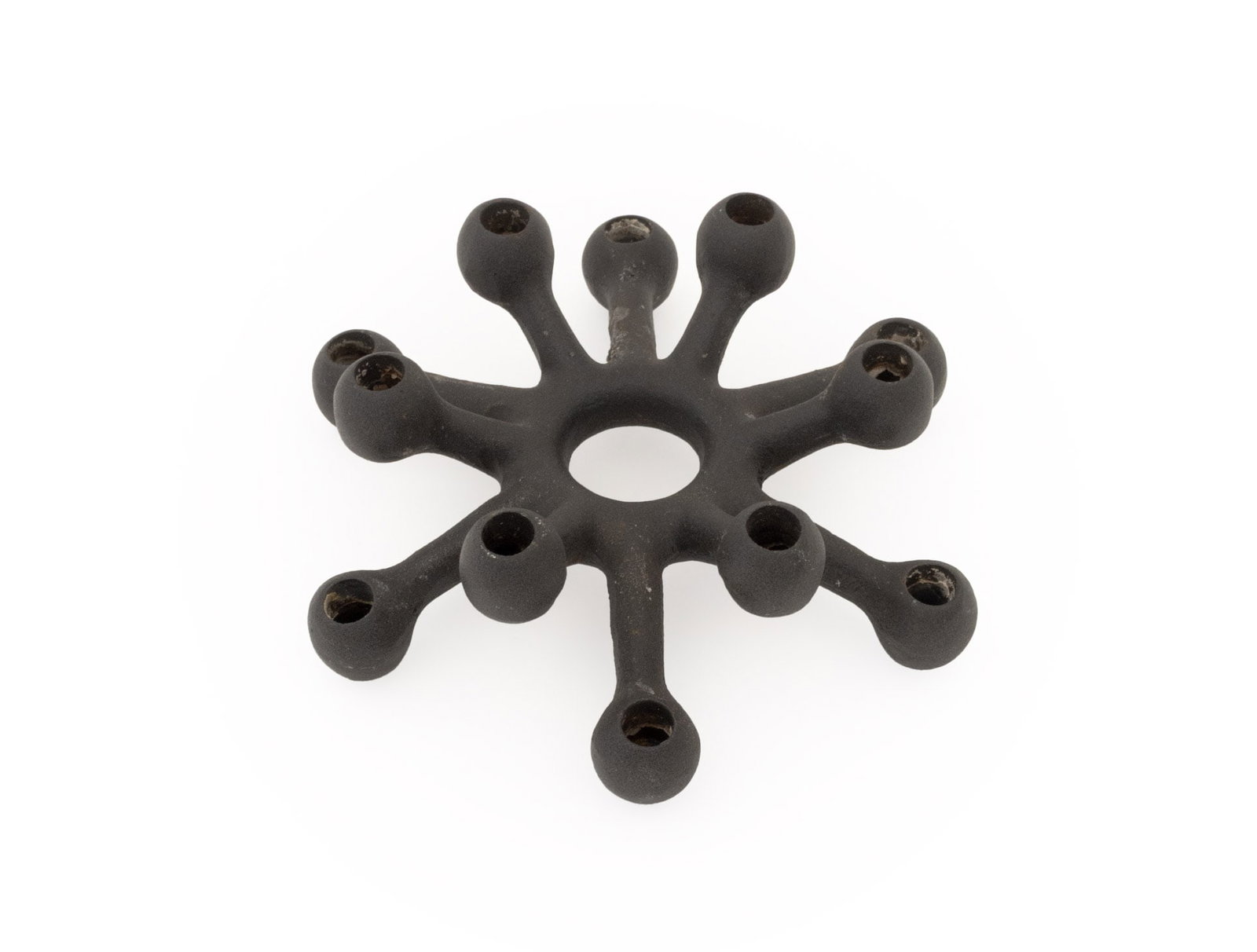 Quistgaard for Dansk Designs Cast Iron Candelabra: Jens Quistgaard for Dansk Designs Cast Iron Spider Candelabra, marked to underside. 1.5" H x 4.25" W x 4" D. Provenance: From a New York City Collection. Keywords: Danish Modern, Candlesticks, Lightin
