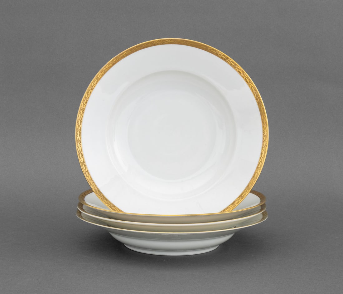 Hutschenreuther Gilt Porcelain Soup Bowls, 4: Set of Four Hutschenreuther Gilt Porcelain Soup Bowls, with gilded foliate trim, marked to underside. 2" H x 10" Diameter. Provenance: The Estate of Alton G. Marshall, former aide to Nelson