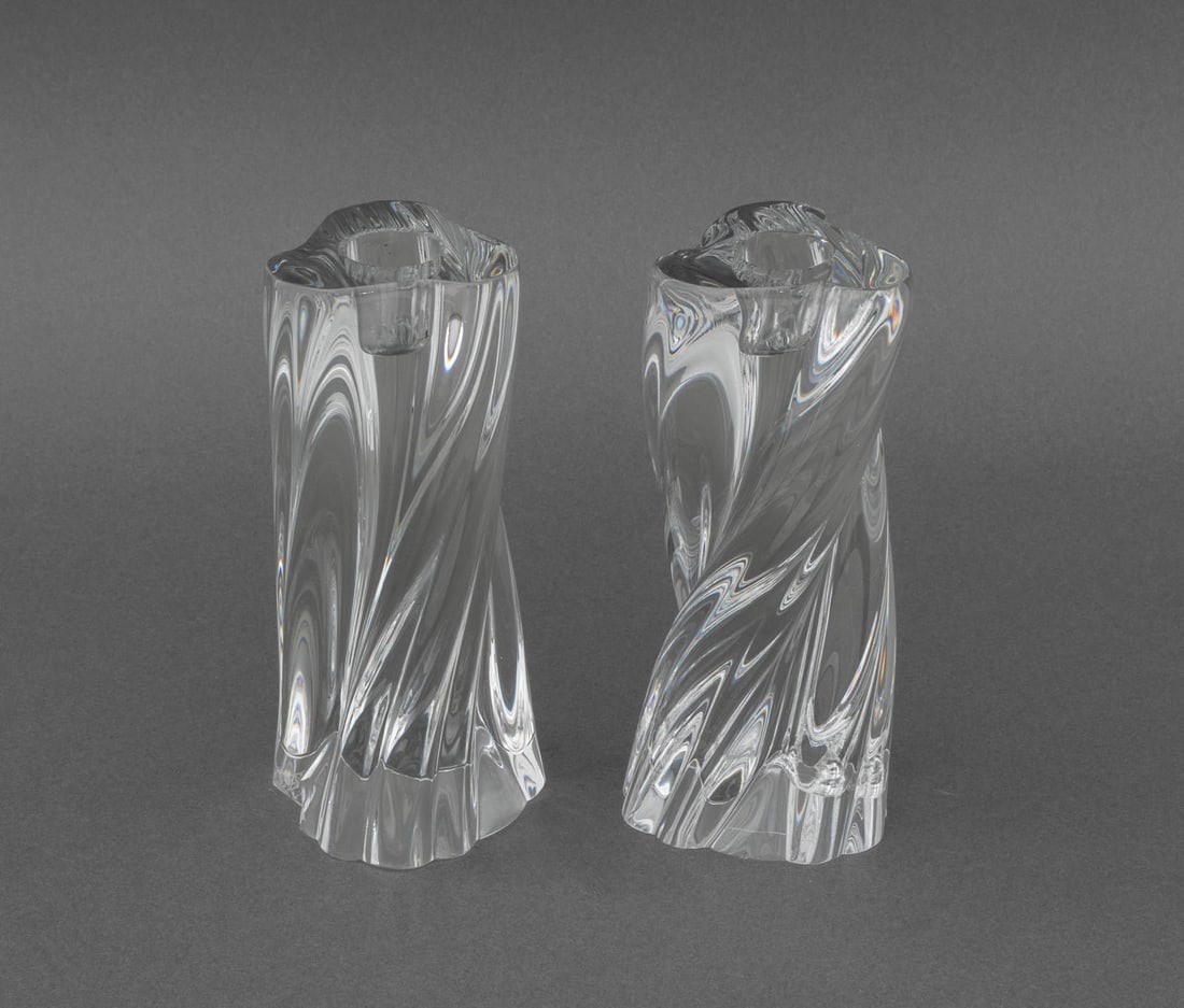 Baccarat Crystal "Odilon" Candlesticks, Pair: Pair of Baccarat Crystal "Odilon" Candlesticks, each marked "Baccarat France" to underside. 6.25" H x 2.5" W x 3" D. Provenance: From a West End Avenue Collection. Keywords: French cristal, Candlehold