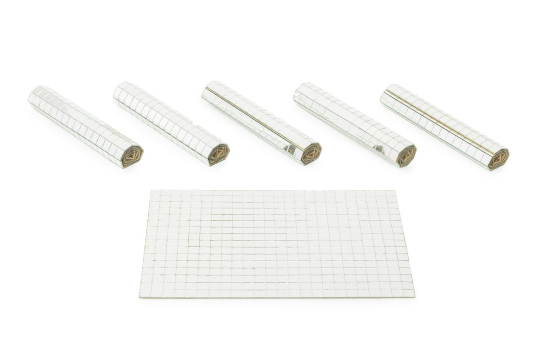 Tomorrow Designs Vintage Mirror Tile Placemats, 6: Set of Six Tomorrow Designs Vintage Mirrored Tile Place Mats, textile to reverse, in original tubes with "Tomorrow Designs" label to top. Mat: 17.25" L x 11.5" W; tube: 12.75" H x 2.5" Diameter.