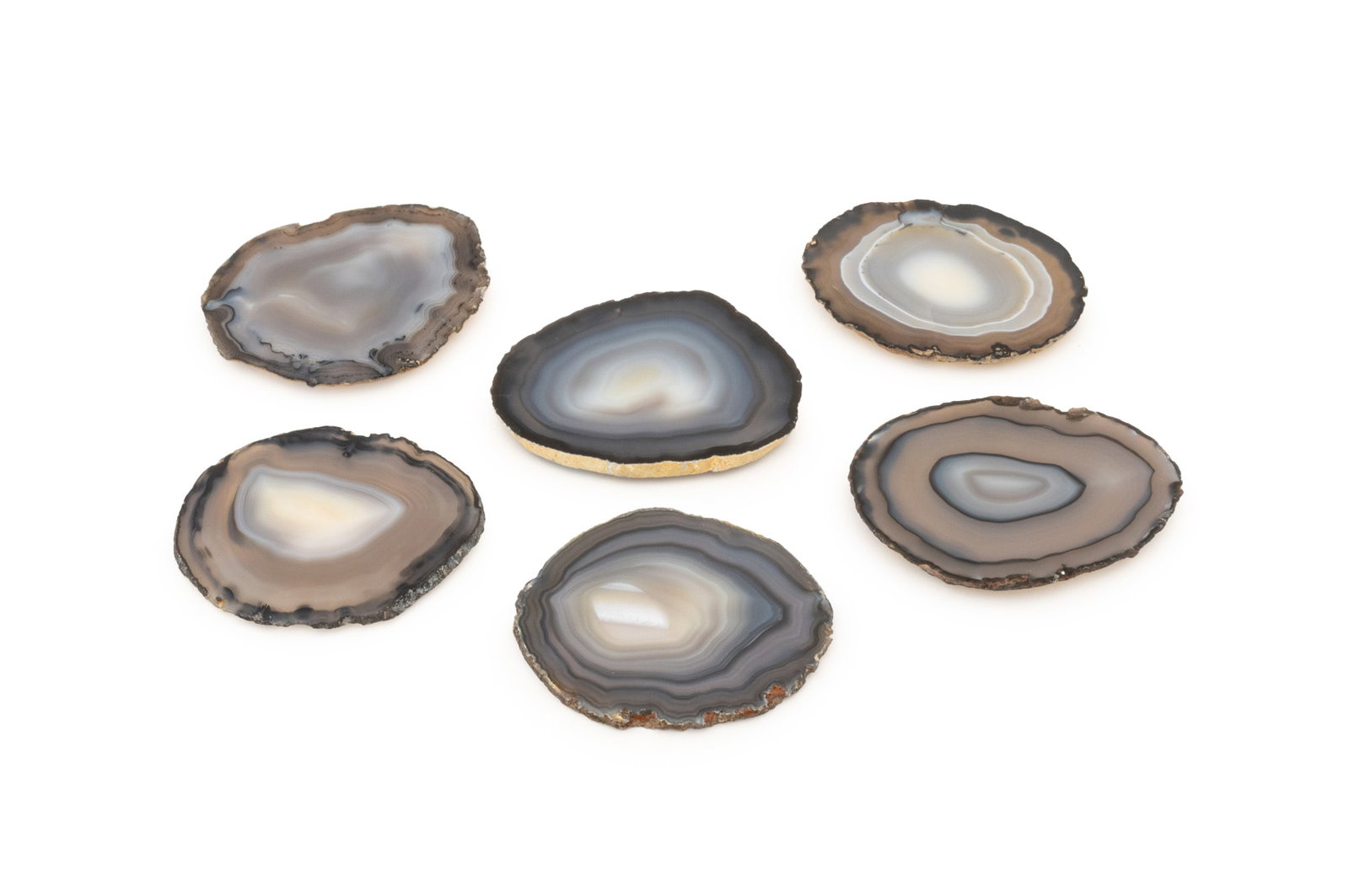 RabLabs Banded Agate Coasters, 6: Set of Six RabLabs Banded Agate Coasters, labels to undersides. 5" L x 4.25" W x 0.25" D. Provenance: From a One Central Park West Estate. Keywords: Designer, Tableware, Drinkware, Barware, Mineral sp
