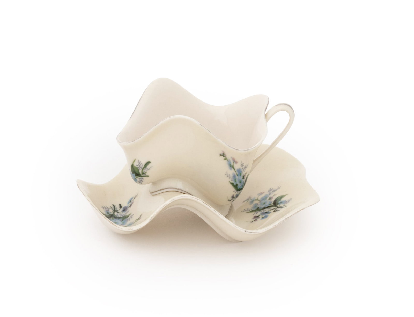 Robert Lazzarini Porcelain Teacup & Saucer, 2003: Robert Lazzarini (American, b. 1965) Glazed Porcelain Teacup and Saucer, 2003, from the edition of approximately 5000 published by Franz Collection, Inc., San Francisco for the Peter Norton Family Chr