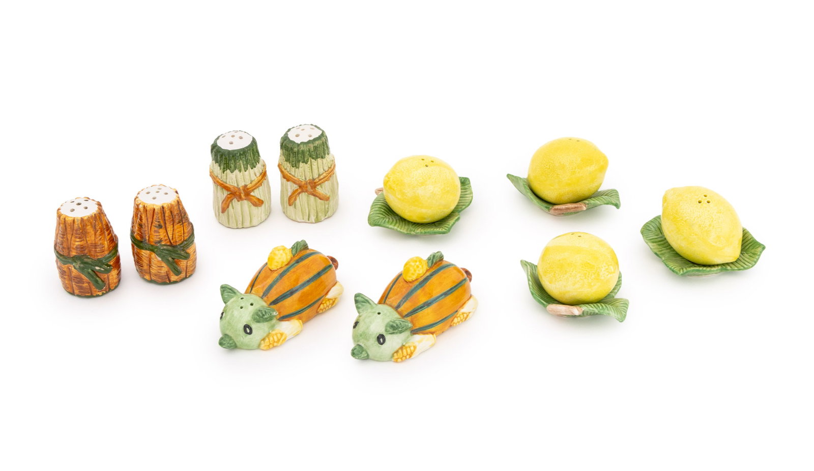 Italian Ceramic Salt and Pepper Shakers, 5 Pairs: Collection of Five Pairs of Italian Ceramic Salt Shakers and Pepper Shakers, comprising: (2) two pairs of lemons on leaves, each marked "FF" to underside, (1) one pair of bunch of asparagus, marked "M