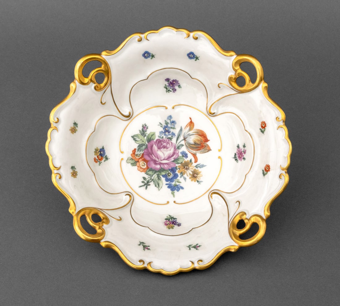 Jlmenau Hand-Painted Porcelain Centerpiece Bowl: Jlmenau Hand-Painted Porcelain Centerpiece Bowl, with gilt trim and floral bouquet to the center, marked "JLMenau / Made in Germany / Hand Enameled / 573 / GG.839" to underside. 2.75" H x 10.5"