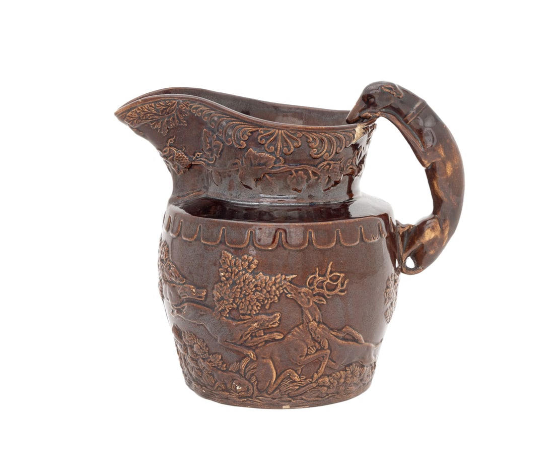 Arthur Wood Attr. Hound Handle Glazed Ceramic Jug: Arthur Wood Attributed Hound Form Handle Brown Glazed Ceramic Jug, unmarked. 8" H x 7.5" W x 6.5" D. Provenance: The Estate of Alton G. Marshall, former aide to Nelson Rockefeller and President of Roc