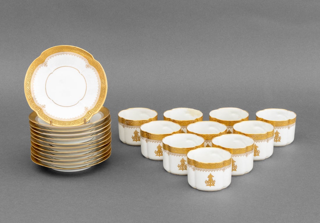 Mansard Houry Gilt Porcelain Teacups & Saucers, 22: Set of Mansard Houry Paris Gilt Porcelain Tea Cups and Saucers, comprising: (10) ten teacups and (12) twelve saucers, marked to underside. 22 pieces total. Overall: 2.5" H x 5.75" Diameter. Provenance