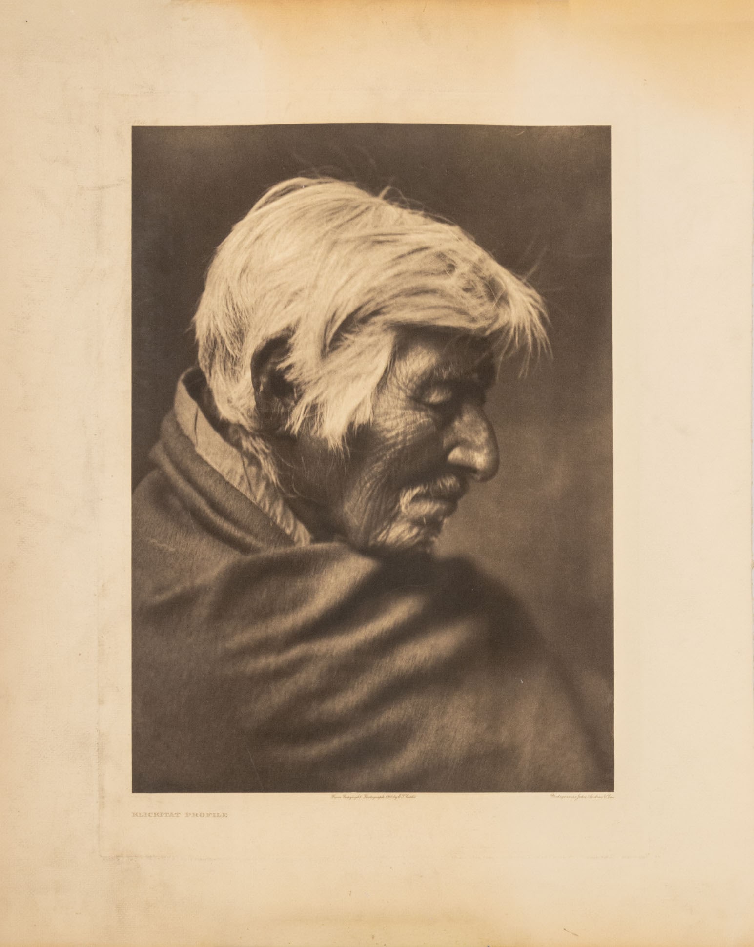 Edward S. Curtis "Klickitat Profile", 1910: Edward Sheriff Curtis (American, 1868-1952), "Klickitat Profile", Photogravure, 1910, unframed. Image: 17" L x 11.5"; sheet: 21.75" L x 17.5" W. Provenance: From a New York City Collection. Keywords: 