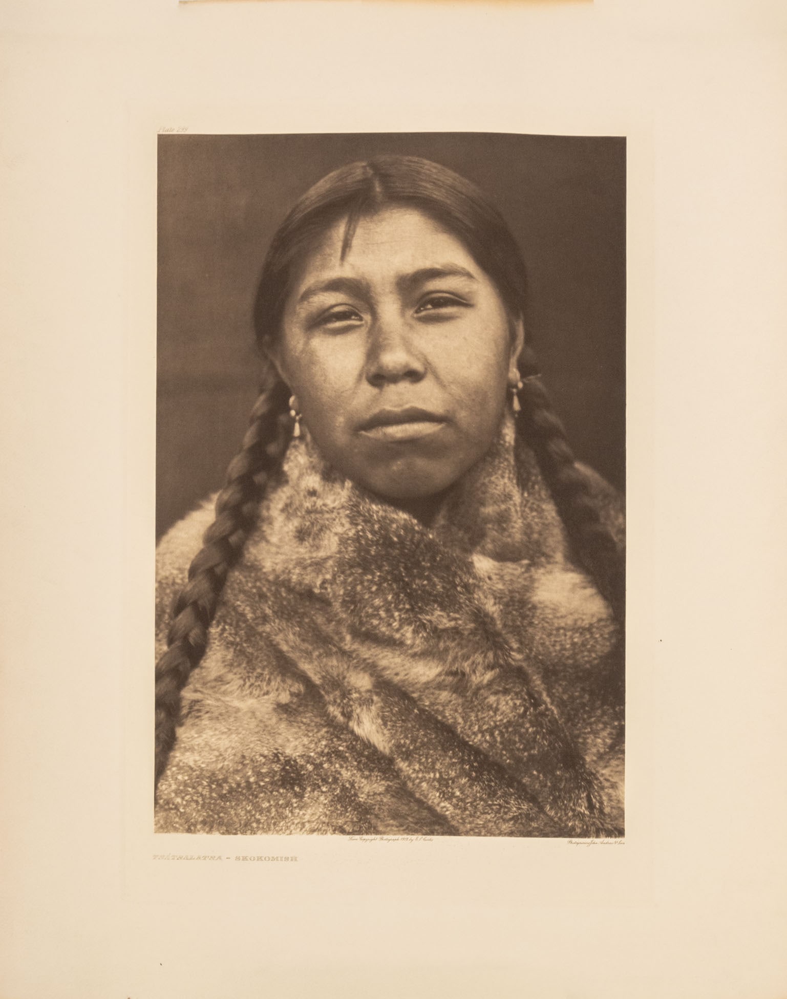 Edward S. Curtis "Tsatsalatsa - Skokomish", 1912: Edward Sheriff Curtis (American, 1868-1952), "Tsatsalatsa - Skokomish", Photogravure, 1912, unframed. Image: 17" L x 11.5"; sheet: 21.75" L x 17.5" W. Provenance: From a New York City Collection. Keyw
