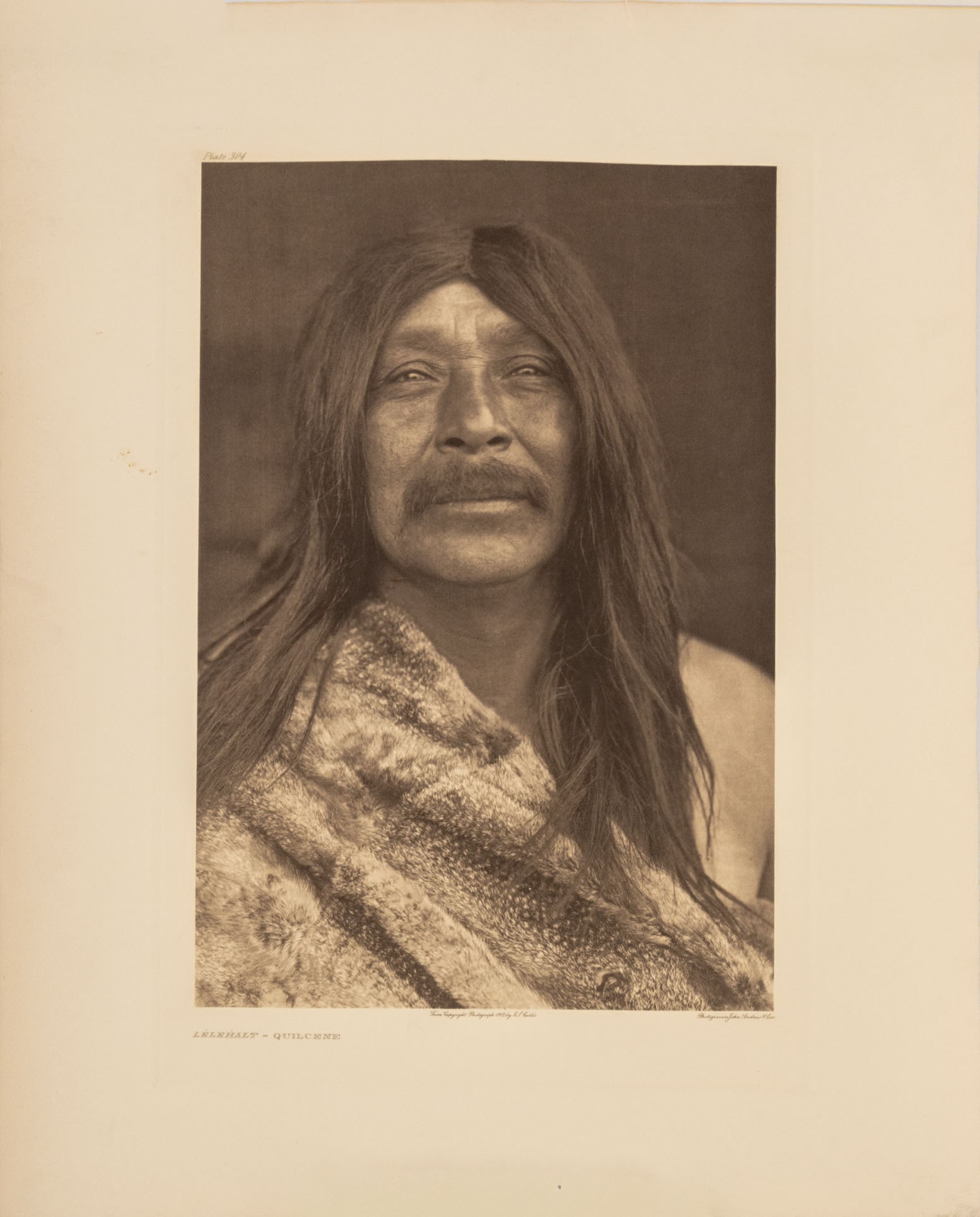 Edward S. Curtis "Lelehalt - Quilcene", 1912: Edward Sheriff Curtis (American, 1868-1952), "Lelehalt - Quilcene", Photogravure, 1912, unframed. Image: 17" L x 11.5" W; sheet: 21.75" L x 17.5" W. Provenance: From a New York City Collection. Keywor