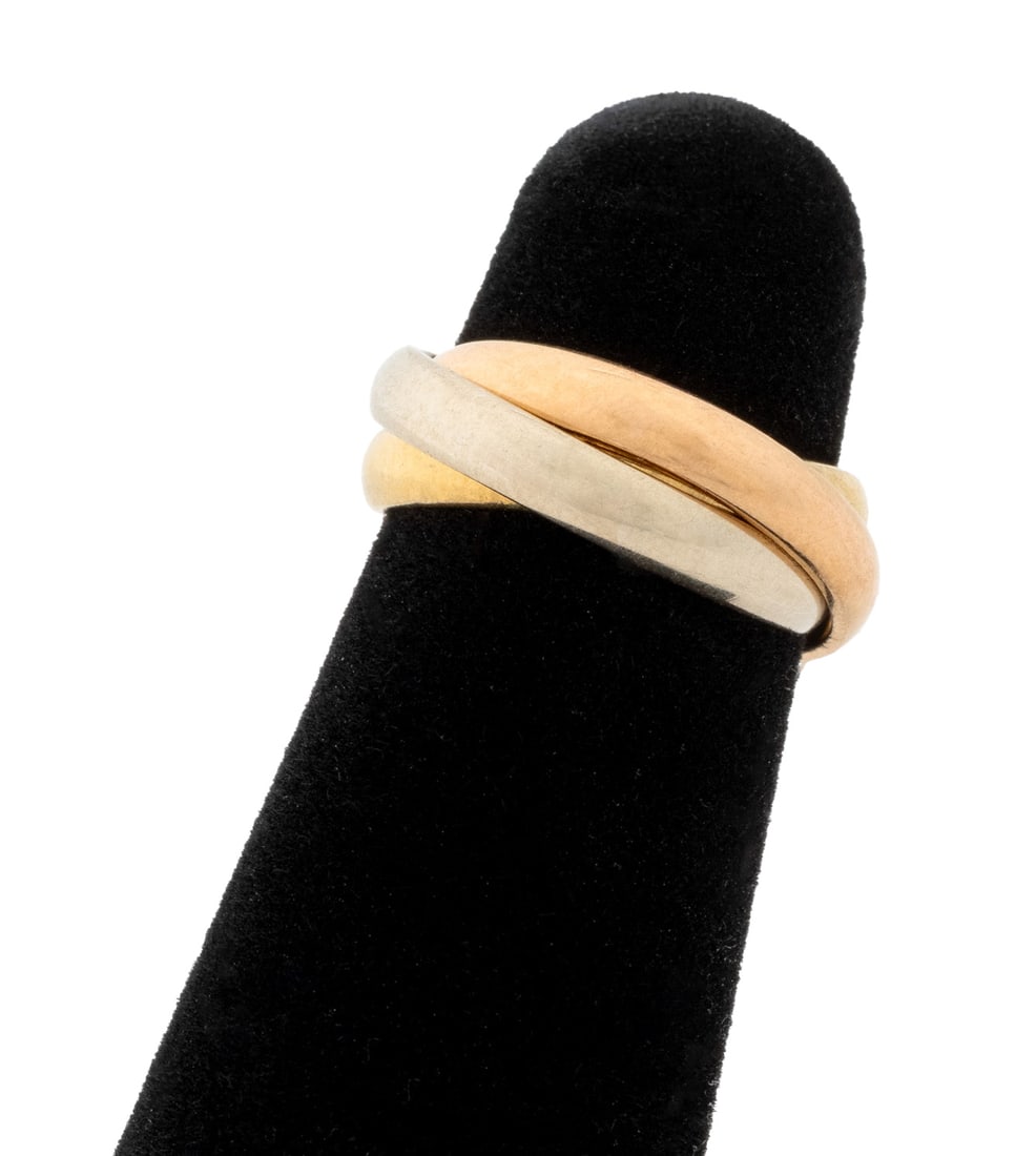 Cartier 18K Tri-Color Gold Trinity Ring: Cartier 18K Rose Gold, White Gold, and Yellow Gold Ring, designed as three inter-linked round band rings, each ring crafted in a distinct hue, marked: "18K CARTIER 3805". Measuring approx. US size 2 1
