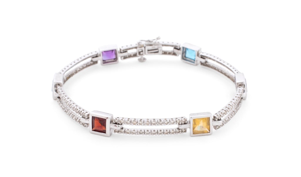 Modern Multi-Color Gemstones & Diamond Bracelet: Modern Blue Topaz, Amethyst, Garnet, Citrine, and Diamonds 14K White Gold Bracelet, adorned with 156 diamonds weighing a total of approx. 1.00 carat, marked: "14K 585 A". Measuring approx. 7 1/8" x 1/