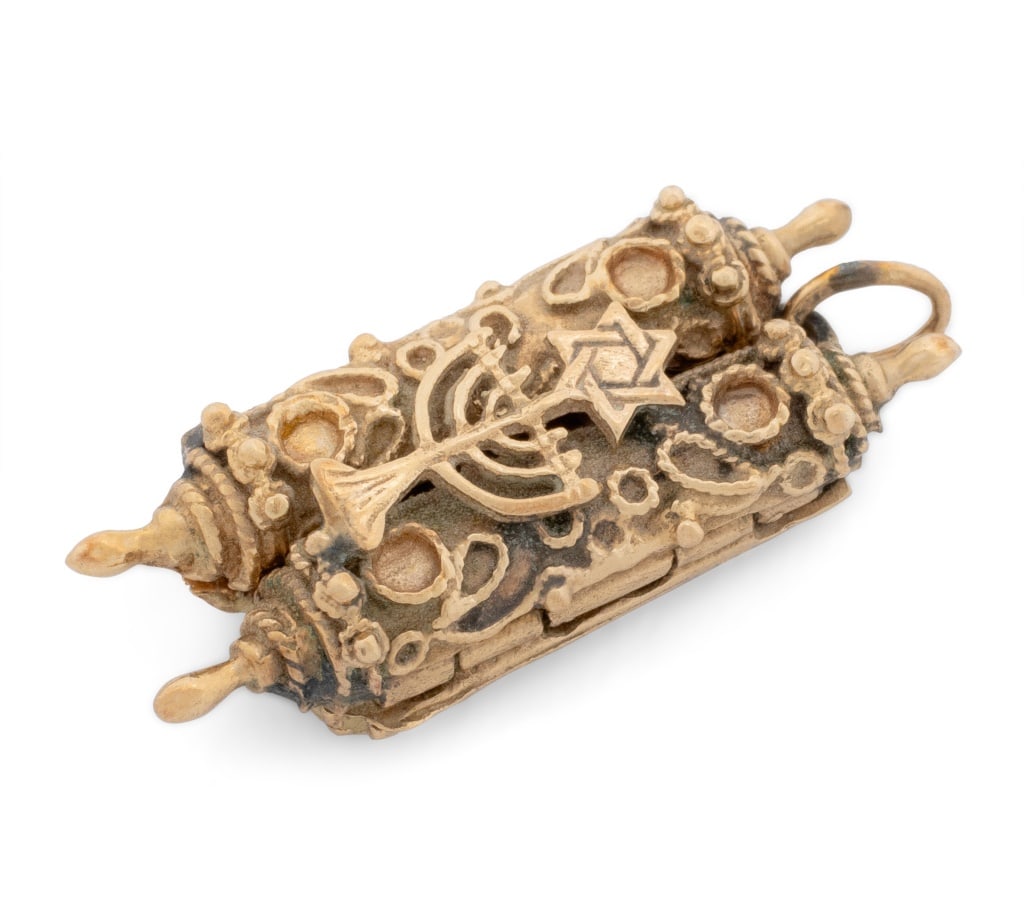 Judaica Torah Form Yellow Gold Pendant: Judaica Torah Form Hinged 14K Yellow Gold Pendant, measuring approx. 1 1/4" x 1/2"; depth: 7.75 mm; weight: 6.1 dwt. Provenance: From a New York City Collection. Keywords: Judaism, Religious Jewelry,
