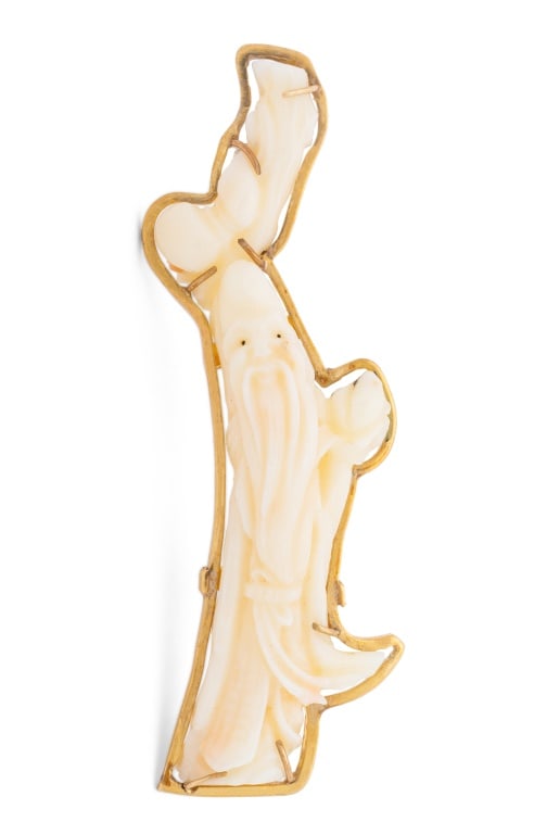 Chinese Carved White Coral and 18K Gold Brooch: Chinese Longevity God Shou Lao Carved White Coral and 18K Yellow Gold Brooch, worn through cloth with pin-set and clasp. Measuring approx. 2 1/2" x 5/8"; depth: 8.5 mm; weight: 7.2 dwt. Provenance: