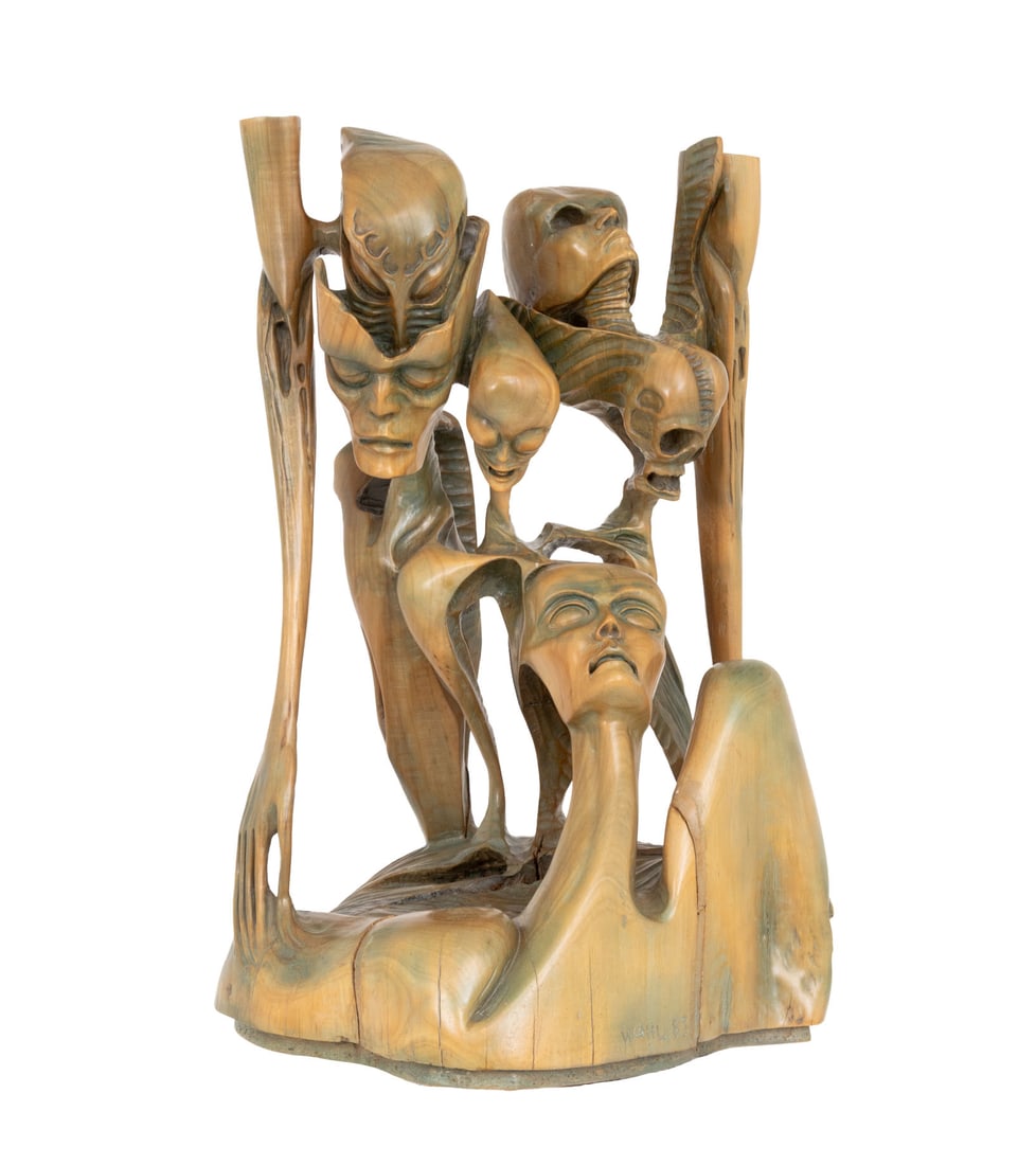 Signed Aliens Group Carved Wood Sculpture, 1983: Figural Group of Aliens Carved Wood Sculpture, 1983, signed "Wahl" and dated to base. 30.5" H x 21" W x 21" D. Provenance: From a Long Island, New York Estate. Keywords: Carvings, Statue, Skulls, Grot