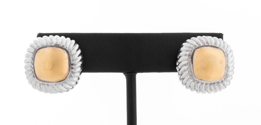 David Yurman Style Silver and Gold Earrings: Pair of David Yurman Style Sterling Silver and 14K Yellow Gold Earrings, featuring yellow gold cushion shaped centers framed by fluted white gold borders, worn through pierced earlobes with posts and 