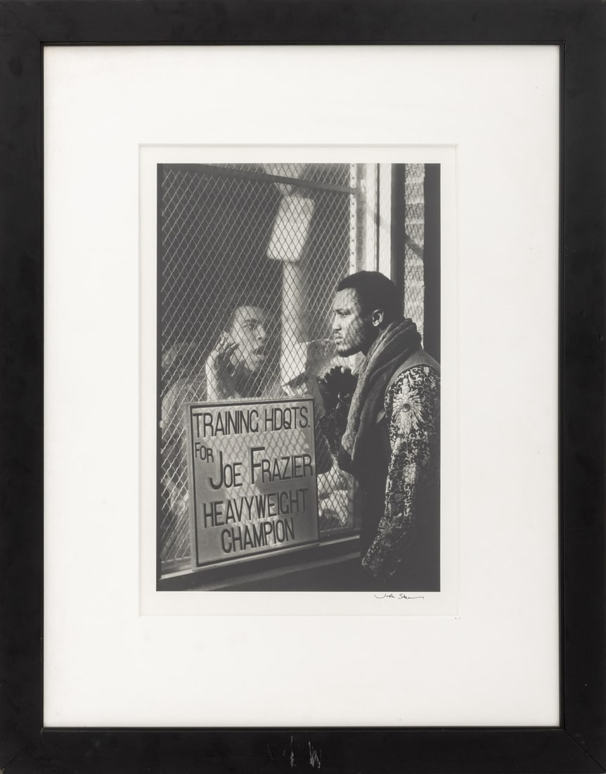 John Shearer "Muhammad Ali ..." Silver Print: John Shearer (American, 1947-2019), Muhammad Ali Taunting Joe Frazier, Gelatin Silver Print, 1971, printed later 2004, signed lower right, titled and inscribed verso, with Certificate of Authenticity 