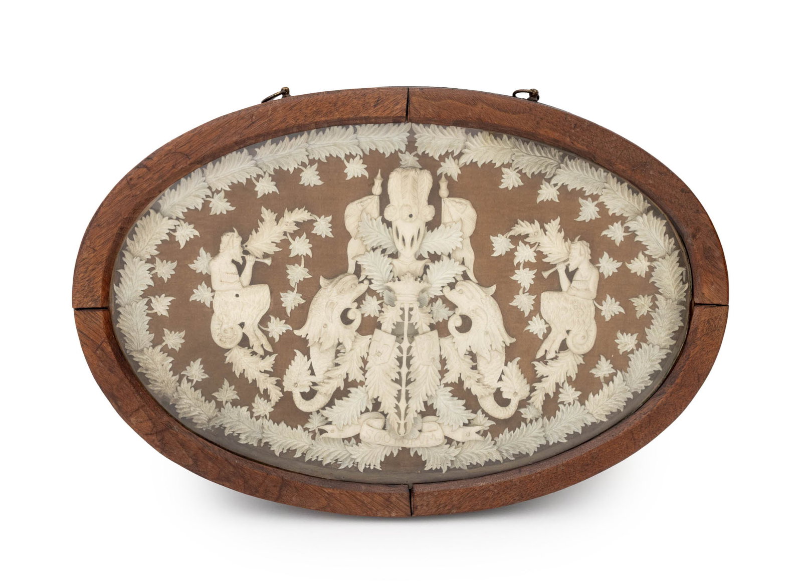 Napoleon III Carved Bone Crest & Leaf Plaque: Napoleon III Carved Bone Crest and Leaf Plaque, 19th century, depicting porpoises and satyrs with leaves and "Sgotorvm" plaque, in oval walnut and beveled glass case. Image: 11" H x 17.75" W; frame: 1