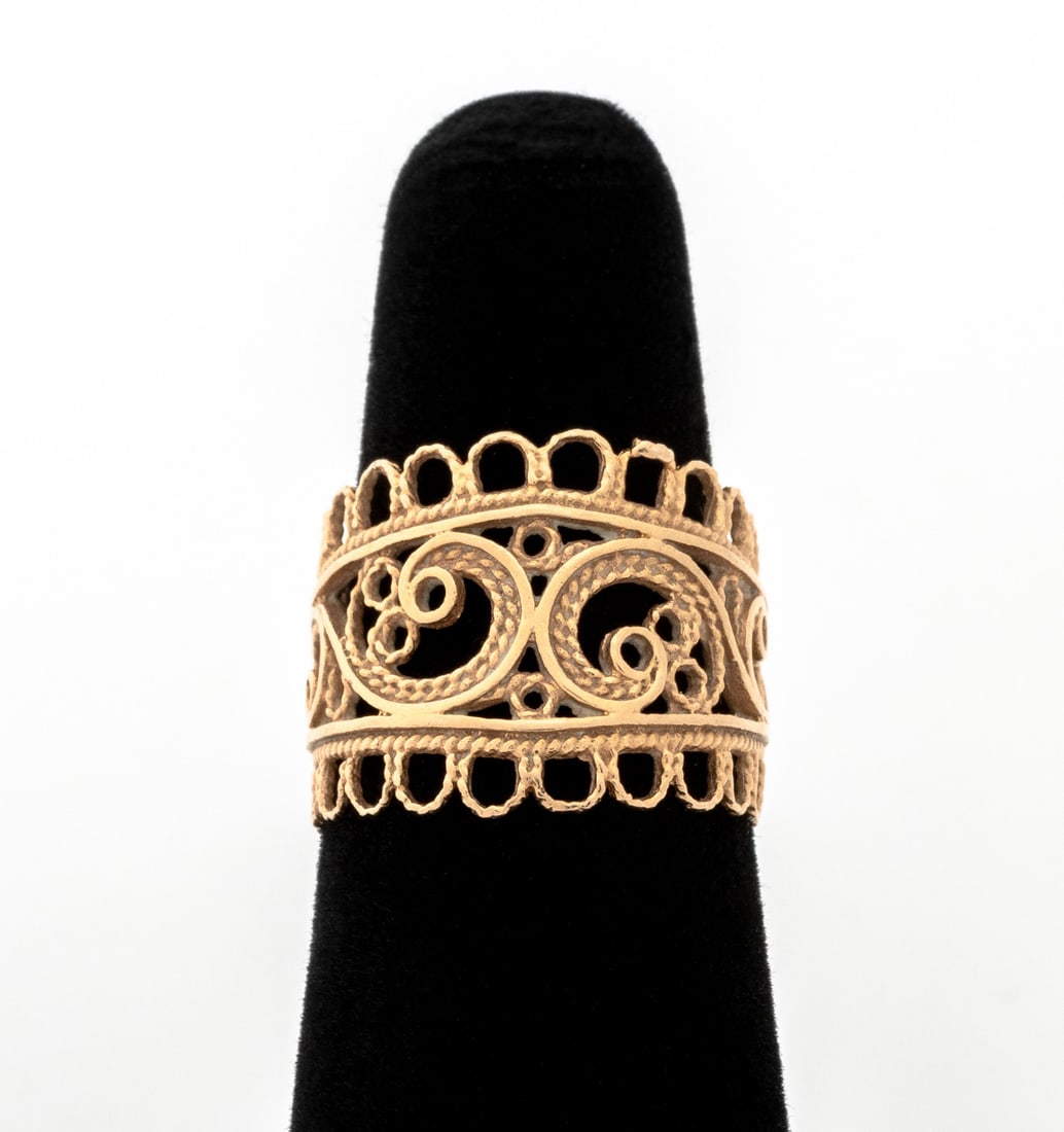 Russian Rose Gold Filigree Ring: Russian 14K Rose Gold Filigree Ring, featuring brightly polished open work with twisted wire decoration along ring edges, marked: "[sp]" Soviet hammer & sickle assay mark "583". Measuring approx. US s