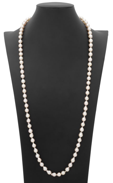 Baroque Pearl Opera Length Necklace: Baroque Cultured Round Drop Pearl Opera Length Necklace with 14K Yellow Gold Clasp, ending in a double sided fishhook bow motif clasp, marked: "585". 83 Cultured Pearls: 8.0 to 8.5 mm approx. Length: