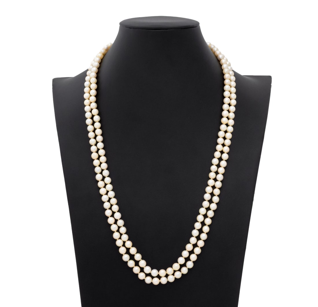Two-Strand Pearl Necklace with Gold Clasp: Two-Strand Pearl Necklace with 14K Yellow Gold Clasp, featuring fully drilled round cultured pearls approx. 6.5 - 7.0 mm, strung on silk cords and knotted between each pearl, joined by 14K yellow gold