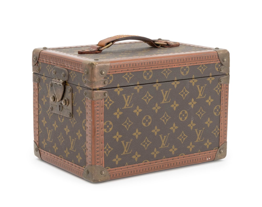 Louis Vuitton Monogram Travel Beauty Case: Louis Vuitton Monogram Travel Beauty Case, brass hardware, Vachettta leather handle, number label "Louis Vuitton / 980099" and three-part strap to interior. 8" H x 11.75" W x 8.25" D. Provenance: A Br