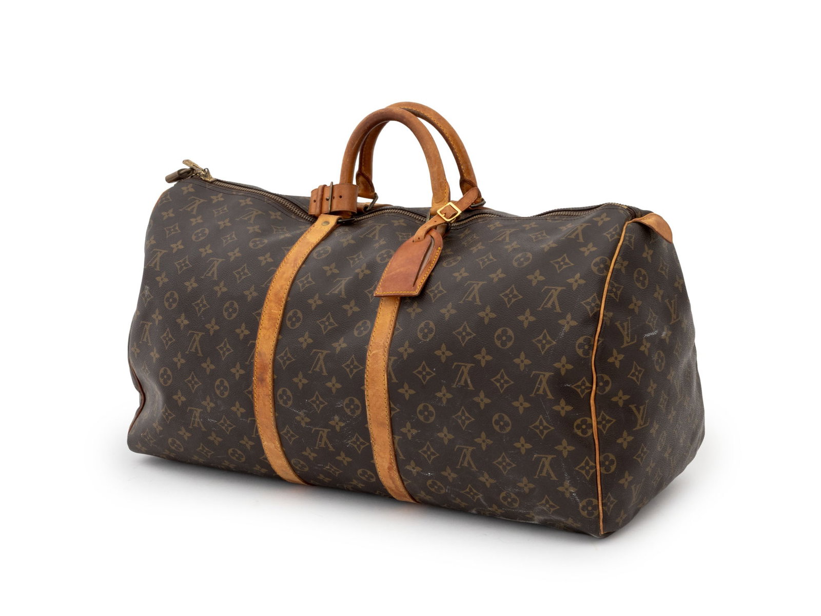 Louis Vuitton Monogram "Keepall" Travel Bag: Louis Vuitton Monogram "Keepall" Travel Bag, Vechetta leather handles, fabric interior. 11.5" H x 23" W x 12" D. Provenance: A Brooklyn Heights, New York Estate. Keywords: Vintage Vuitton, LV, Luggage