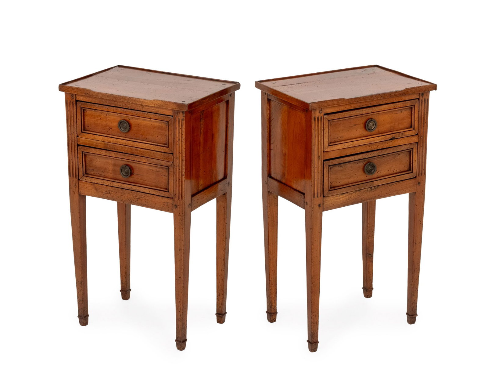 Louis XVI Style Fruitwood Bedside Tables, Pair: Pair of Louis XVI Style Fruitwood Bedside Tables, each with two drawers on fluted tapered legs. 28.5" H x 15.75" W x 11" D. Provenance: From the Estate of Gerard Stora, Vice President of Wildenstein