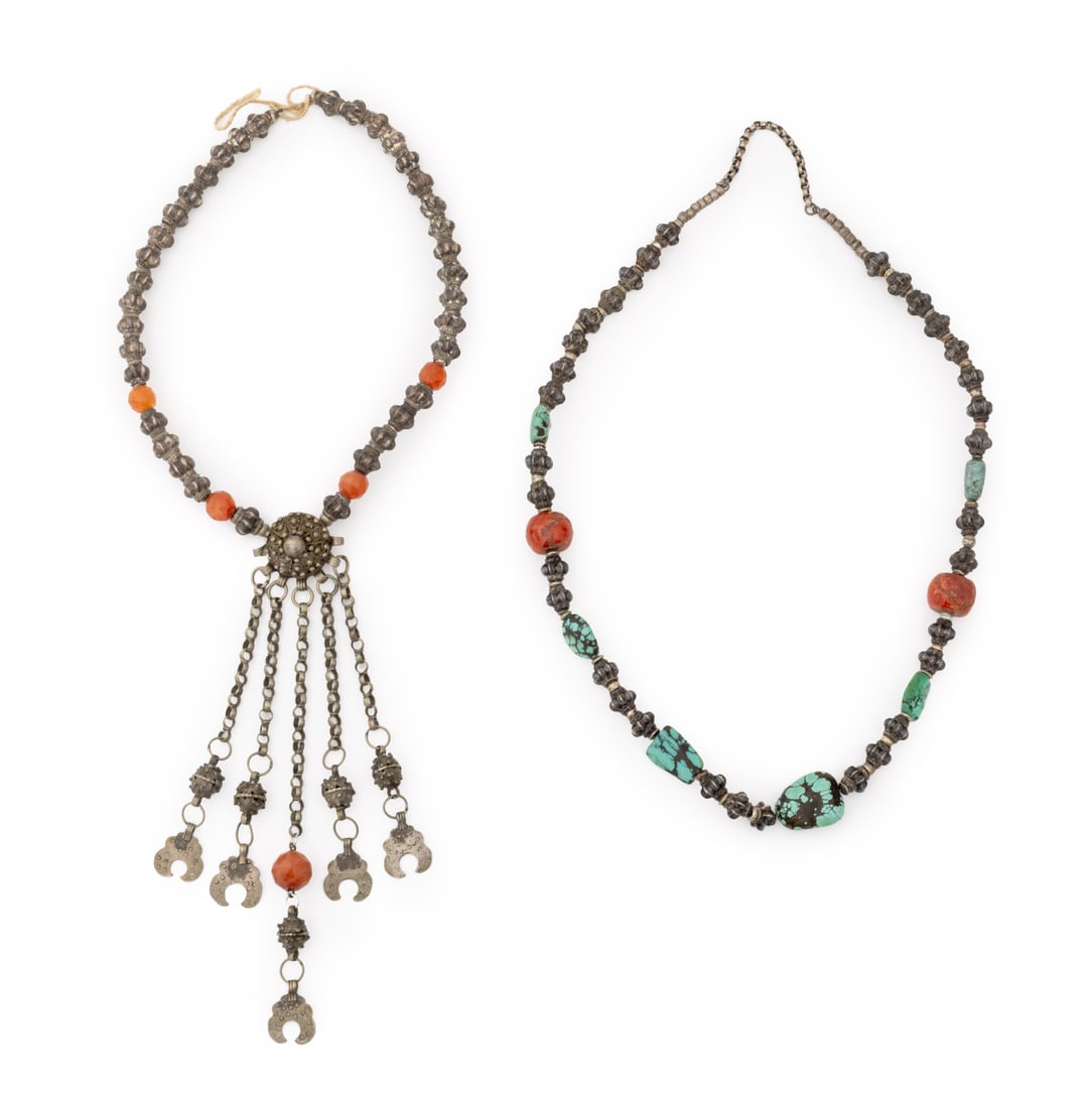 Yemeni Silver and Silver-Tone Beaded Necklaces, 2: Two Yemeni Silver and Silver-Tone Metal Beaded Necklaces, one with turquoise and red coral beads and one with faceted carnelian beads. 38" L x 3.75" W. Provenance: From the Estate of Jewelry Designer 