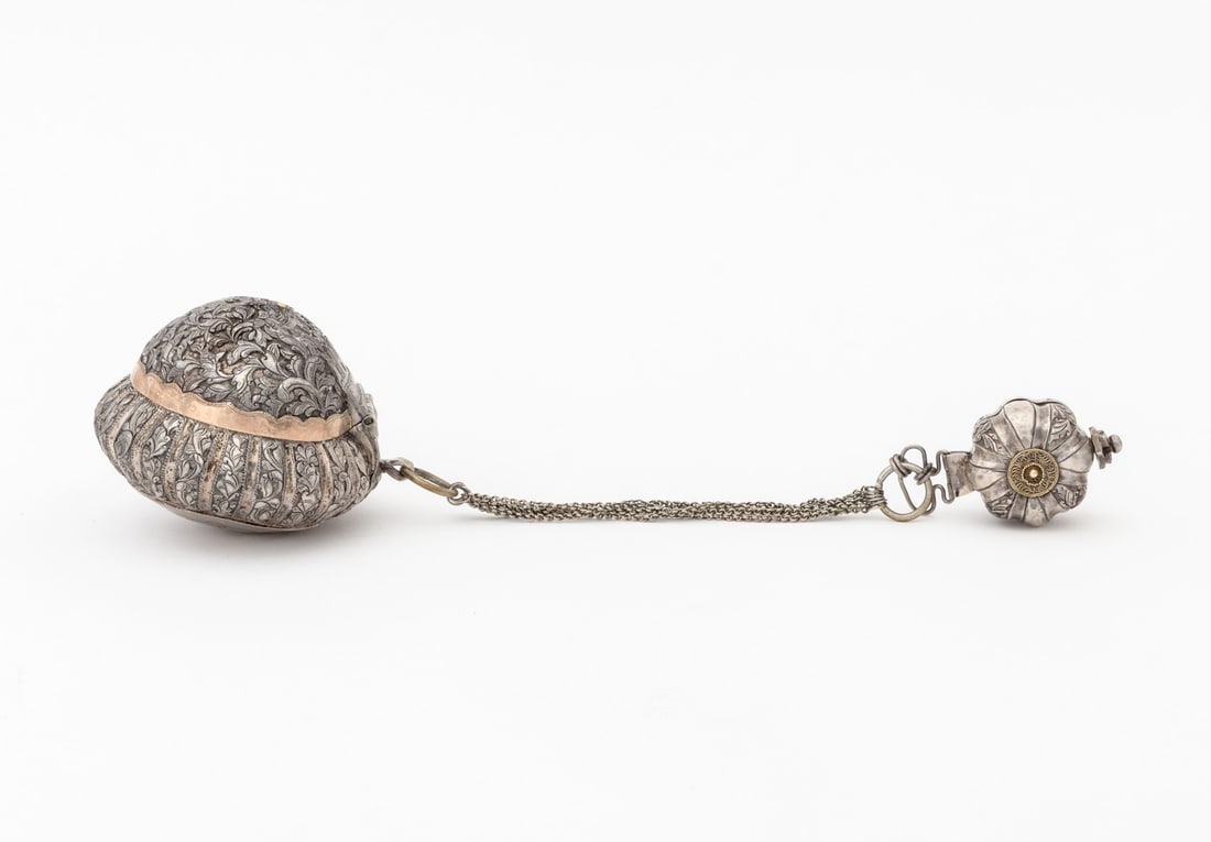 Burmese Gourd Form Silver Betel Nut Boxes, 2: Two Burmese Gourd Form Silver Betel Nut Boxes, 19th century, the larger with gold plated details and chased floral design to underside, the smaller with repousse decoration. Weight: 7.82 ozt.; larger: