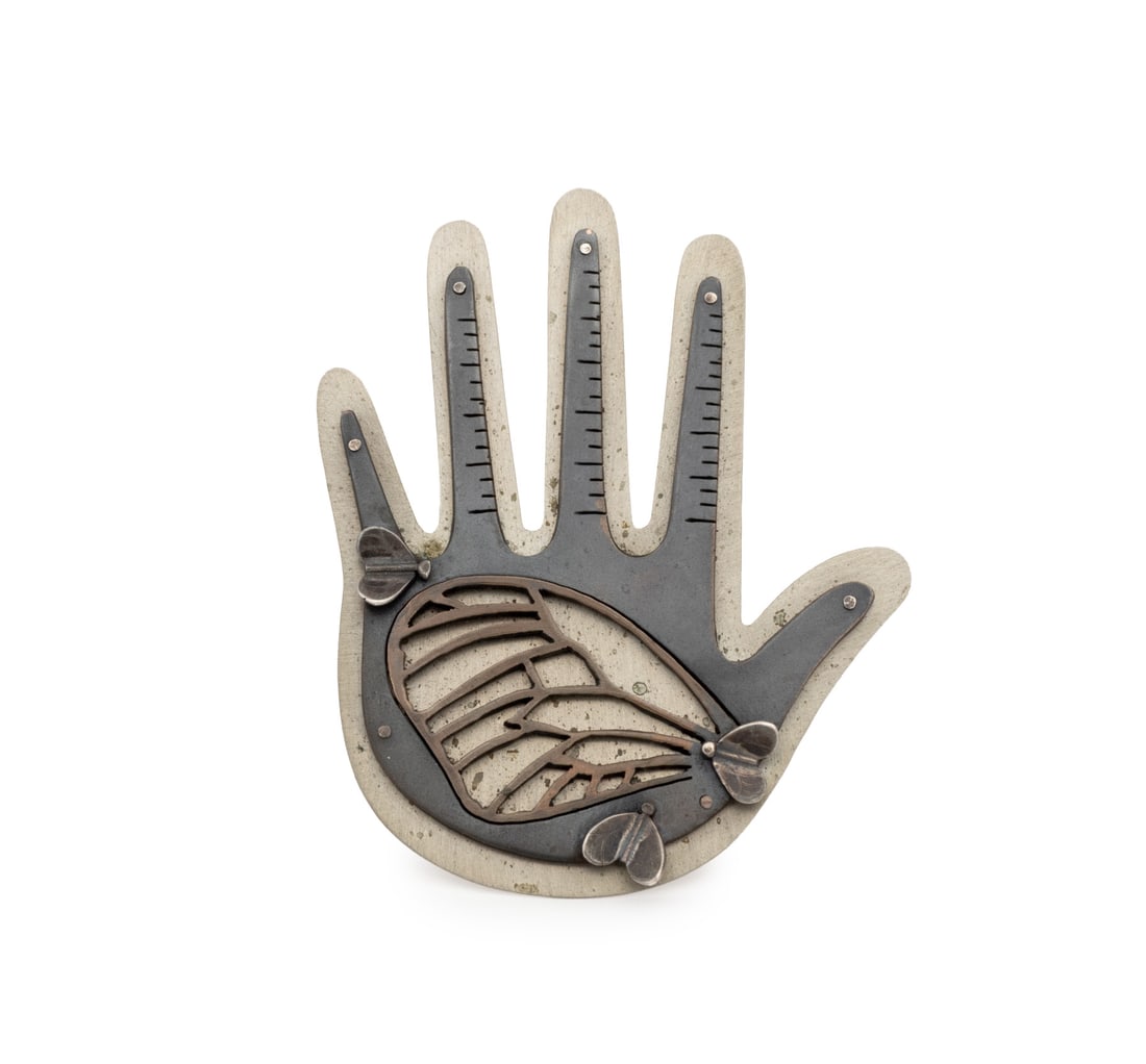 Kiff Slemmons Hand Form Brooch, 1980s: Kiff Slemmons (American, b. 1944) Hand Form Metal and Silver Brooch, 1980s, the palm with butterfly motif, from the "Hands of the Heroes" series, unmarked. Silver tested. Silver not weighable. 3.25" L